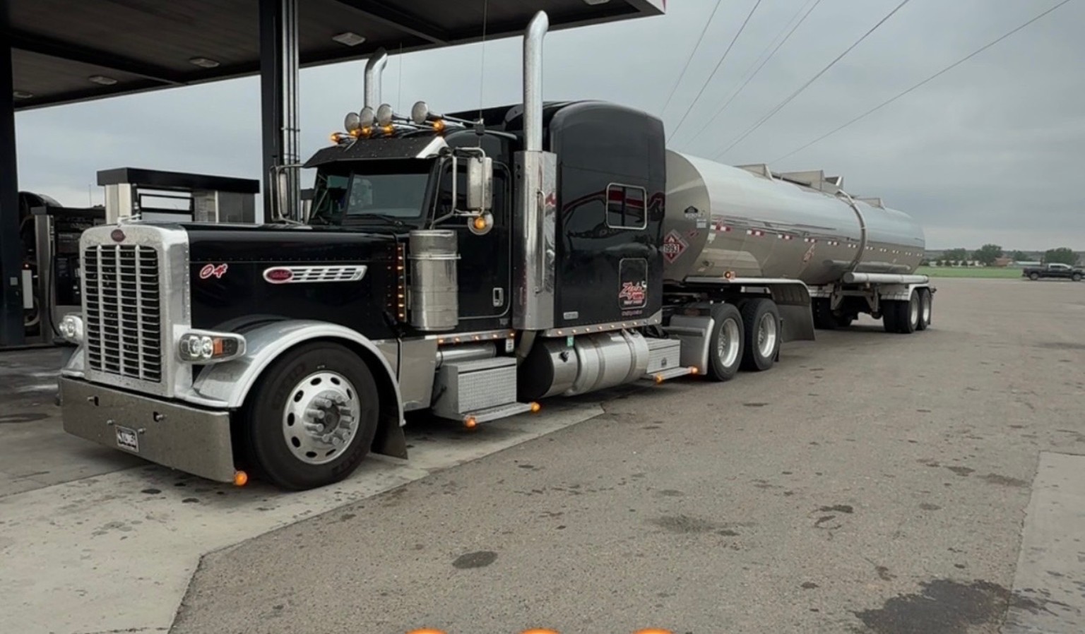 Black Ziglar Transport Peterbilt with a polished bulk tanker